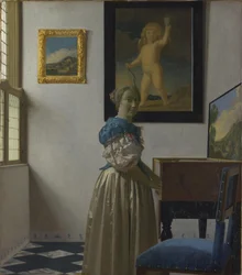 Eine junge Frau an einem Virginal