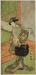 Der Schauspieler Yamashita Kinsaku II als Miyagino verkleidet als Friseur im Stück Kosode-gura no Tekubari, aufgeführt im Morita Theater im zweiten Monat, 1772 (?)