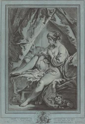 Junge Frau auf einem Bett sitzend