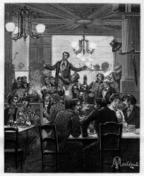 In der Mitte leitet Desroches auf einem Tisch den Charivari. Szene in einem Pariser Café: Menschen singen, trinken, rauchen, plaudern und flirten an den Tischen. In „Trente ans de Paris“, einer autobiografischen Sammlung von Alphonse Daudet (1840-1897).
