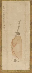 Stehender Mann in rotem Mantel