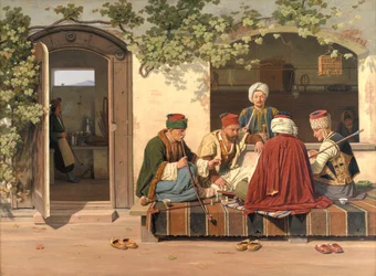 Eine Gruppe von Schachspielern vor einem türkischen Kaffeehaus und Friseursalon