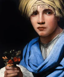 Junge mit Turban, der einen Blumenstrauß hält