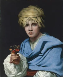 Junge mit Turban hält einen Blumenstrauß
