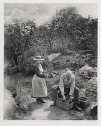 Ein alter Mann und seine Tochter beim Gärtnern