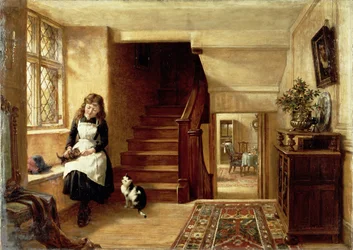 Ein Interieur mit einem Mädchen, das mit Katzen spielt