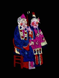 Paar in traditioneller Kleidung. Gemaltes Papierschnittbild oder "Jian Zhi", chinesische Volkskunst, Peking