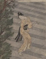 Junge Frau steigt Steintreppen zu einem Shinto-Tempel hinauf
