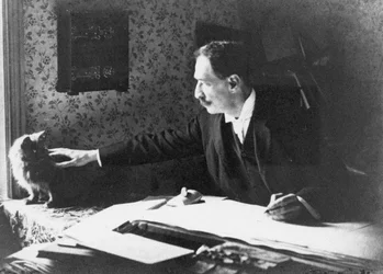 Louis Wain an seinem Zeichentisch, 1890er Jahre