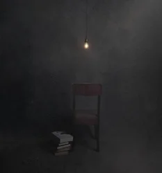 Dunkler Raum leerer Stuhl